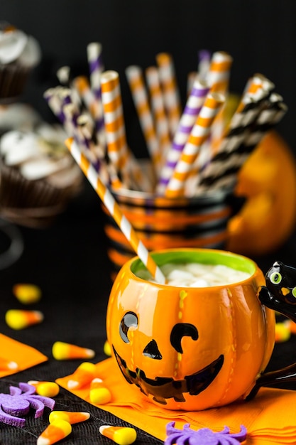 Chocolate Halloween cupcakes with white buttercreme icing and chocolate shavings on top.