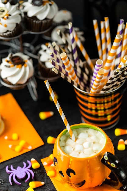 Chocolate Halloween cupcakes with white buttercreme icing and chocolate shavings on top.