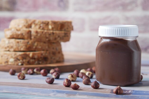 Chocolate hazelnut cream in a container on table