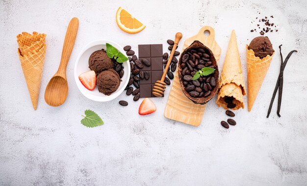 Chocolate ice cream flavours in bowl setup on white stone .