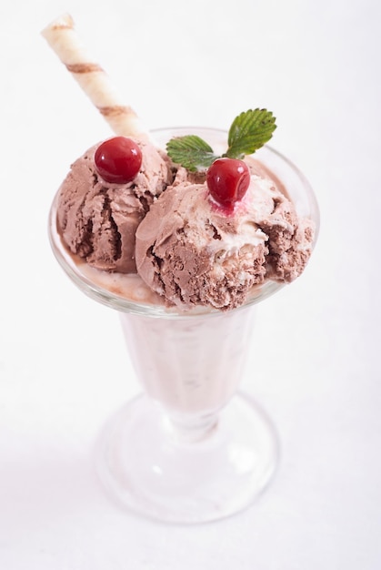 Chocolate ice cream scoops with cherry