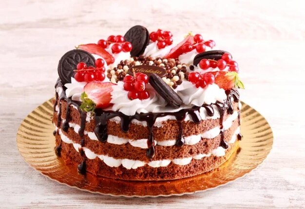 Chocolate layered cake with fruit and berry decoration