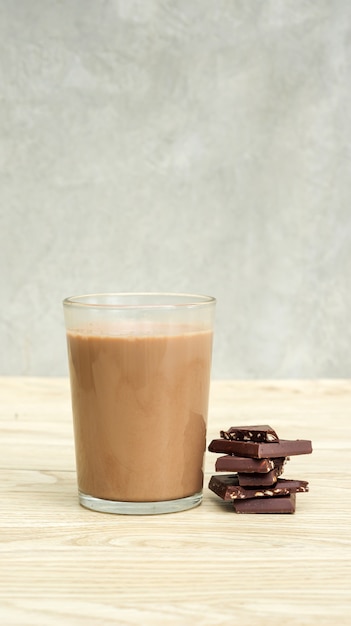 Chocolate milk on a wooden table.