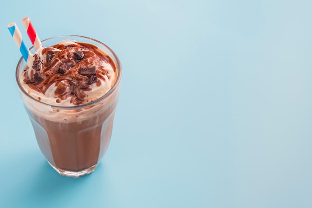 Chocolate milkshake in color background