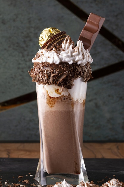 chocolate milkshake with whipped cream and chocolate - topping bar decoration