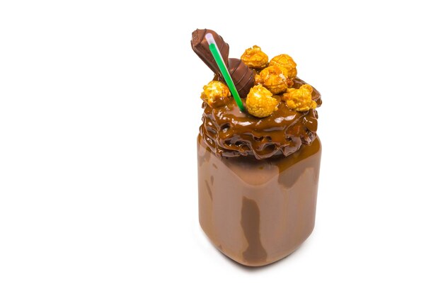 Chocolate milkshake with whipped cream, cookies, waffles, served in glass mason jar. "Freak or crazy" sweet shake. Isolated. Space for text or design.