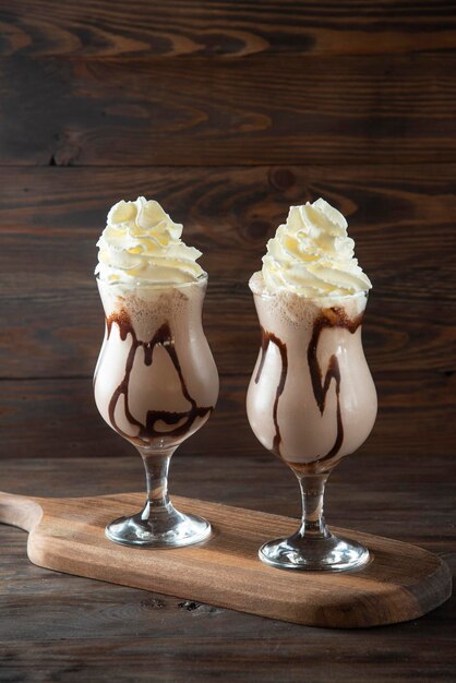 Chocolate Milkshake on wood cutting board