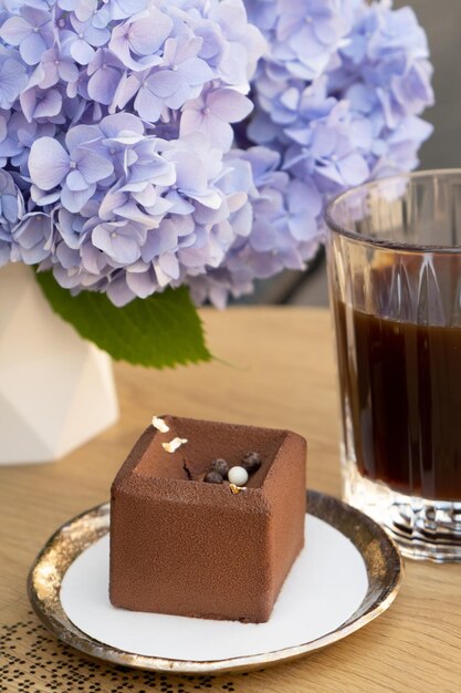 Chocolate mousse cake on a wooden cafe table