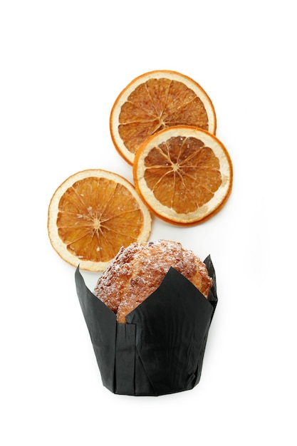 Chocolate muffin with orange slices isolated on white background.