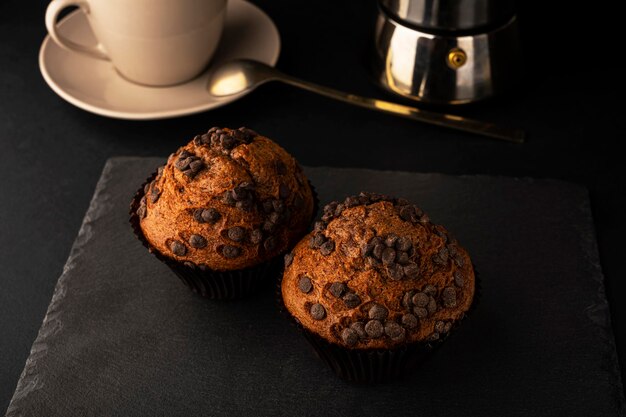 Chocolate muffins for breakfast. Homemade fluffy chocolate cupcakes. Cupcakes with chocolate and cin