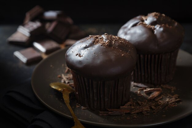 Chocolate muffins on a brown plate