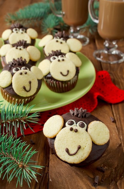 Photo chocolate muffins monkey. the symbol of the new year