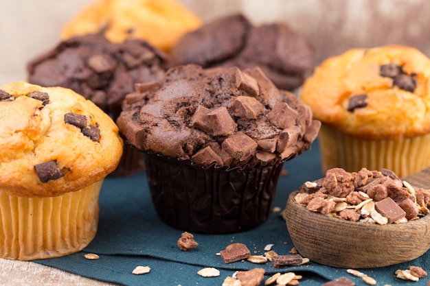 Chocolate muffins with chocolate vintage background, selective focus.