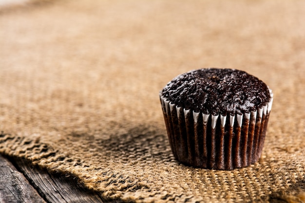 Chocolate muffins on wooden table