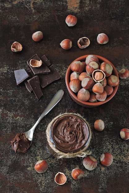 Chocolate nut paste and unpeeled hazelnuts.