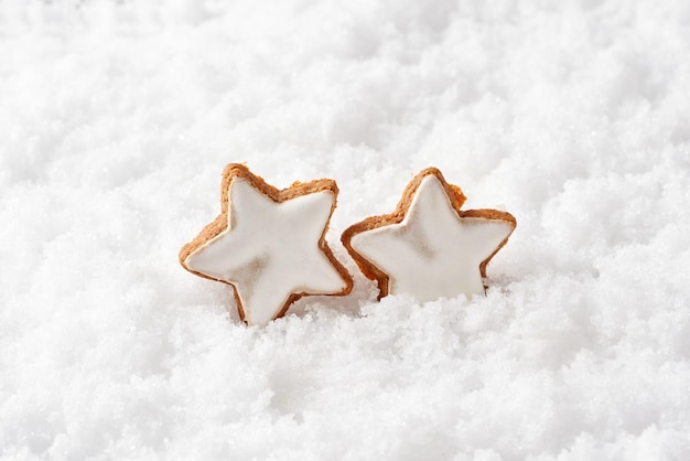 Chocolate nut star cookies christmas cookies in the snow.