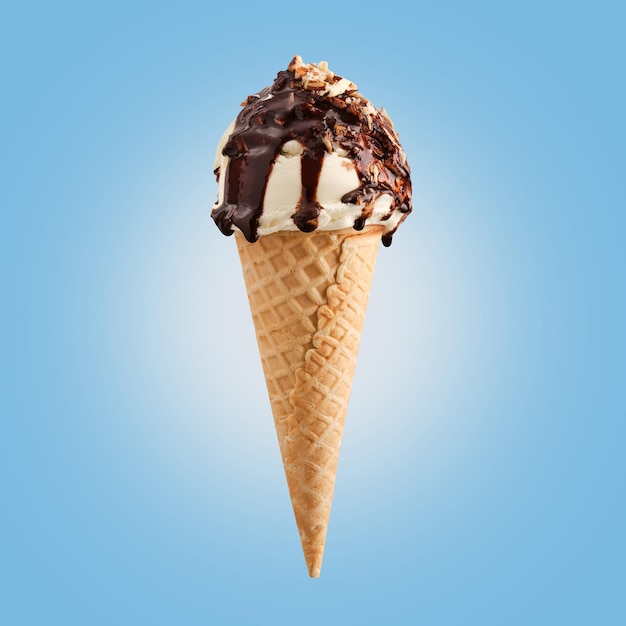 Chocolate nuts ice cream cone on blue background. Chocolate lays on creamy ice cream