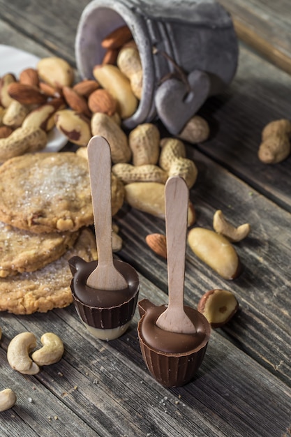 chocolate and nuts on wooden table