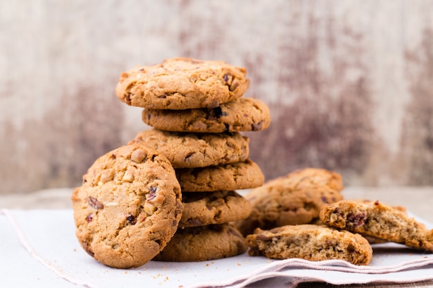 Chocolate oatmeal chip cookies on the rustic wooden table.