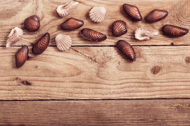 Chocolate on old wooden table