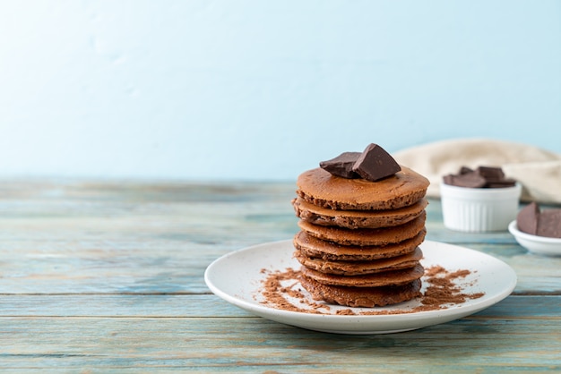 chocolate pancake stack with chocolate powder