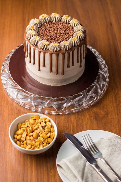 Chocolate and peanut cake. charge cake. On wooden background.