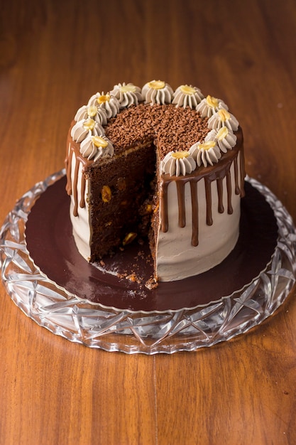 Chocolate and peanut cake. charge cake. On wooden background.