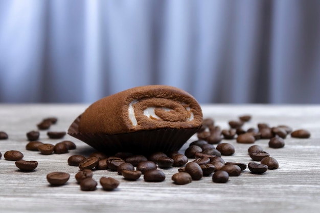 Chocolate roll and coffee beans