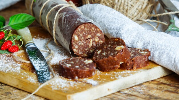 Chocolate salami with biscuits and hazelnuts