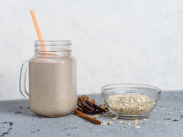 Chocolate smoothie with oatmeal and nuts in a jar