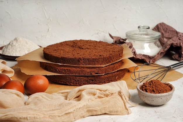 Chocolate sponge cake layers sponge cake shortcakes on baking
grid text space selective focus close up