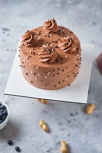 chocolate sponge cake stuffed with salted caramel and peanuts cake with chocolate cream