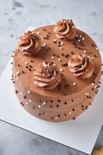 chocolate sponge cake stuffed with salted caramel and peanuts cake with chocolate cream