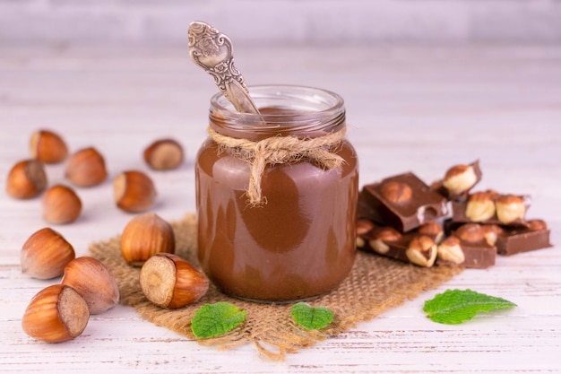 Photo chocolate spread with hazelnut flavor in a jar