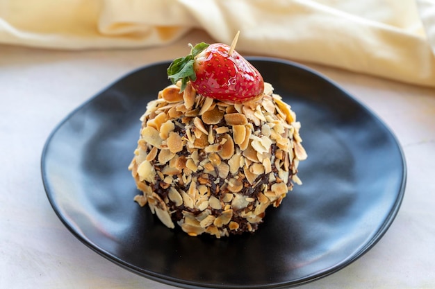 Chocolate and strawberry cake filled with nut chips