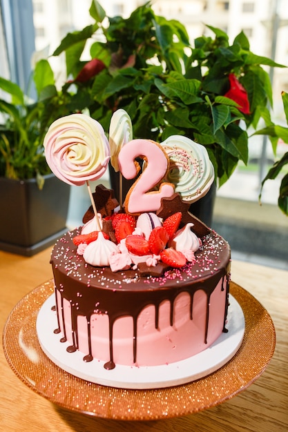 Chocolate-strawberry cake with number two