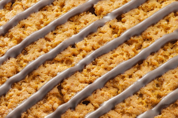 Chocolate stripes on oatmeal cookies closeup diagonally