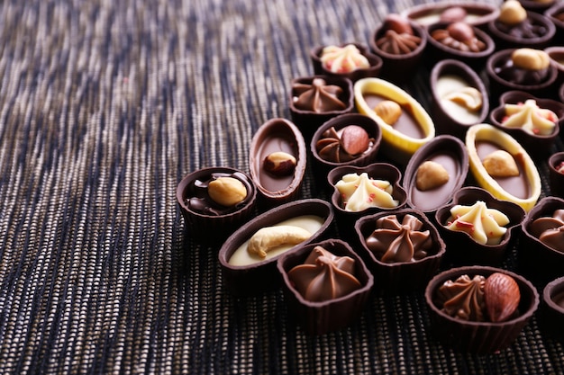 Chocolate sweets on fabric background