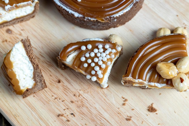 Chocolate tartlet with cream filling and salted caramel with nuts