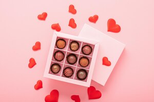 chocolate truffle candies in a box on a pink background with valentines valentines day concept festive food gifts