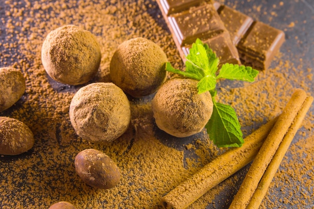 Chocolate truffle. Chocolate sweets from truffles with cocoa powder. Vanilla.