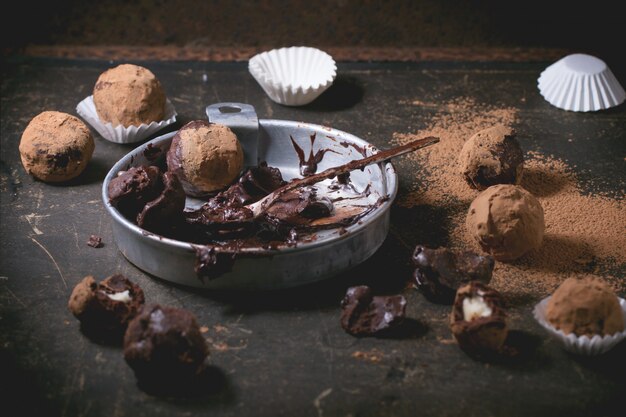 Chocolate truffles on concrete