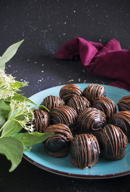 Chocolate truffles on dark background