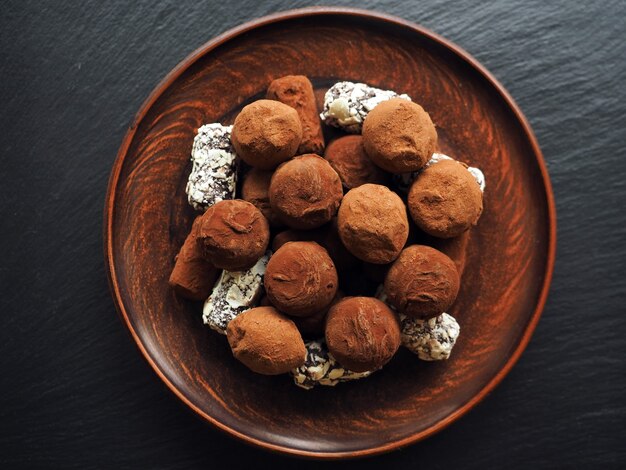 Chocolate truffles on dark table