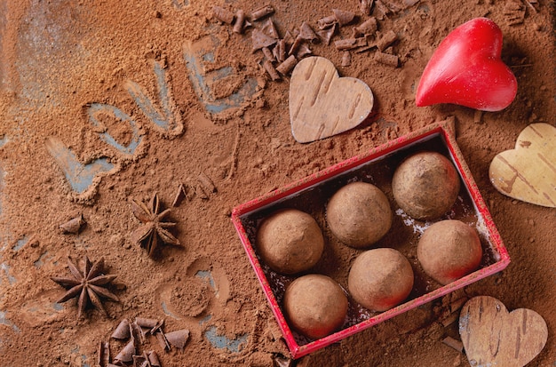Photo chocolate truffles with valentine's hearts
