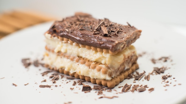 A chocolate and vanilla ice cream dessert with chocolate shavings on top.