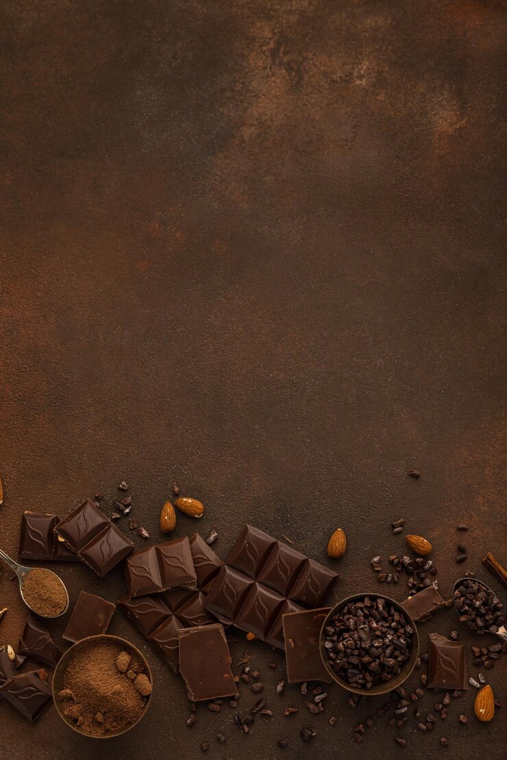 Chocolate variety on brown background copy space