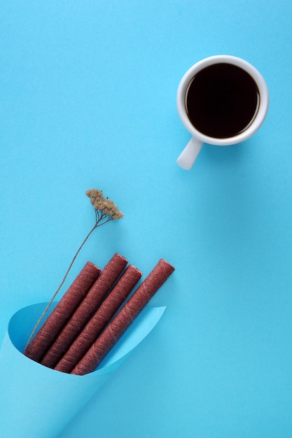 Chocolate wafer sticks and coffee