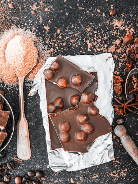 Chocolate with nuts and spices on a table