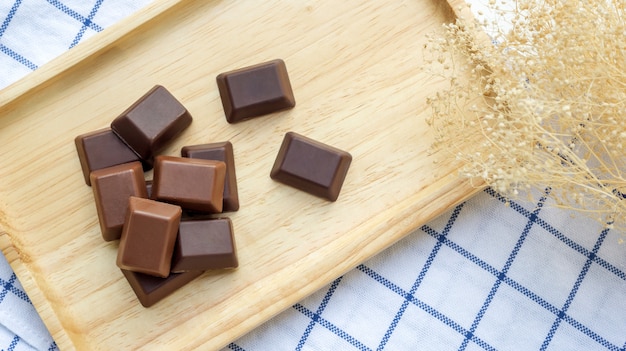 Chocolate on a wooden plate.